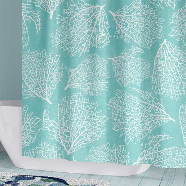 Beach-themed fabric shower curtain in coastal blue with coral print