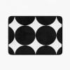 Black and white geometric patterned microfiber bath mat with artist-designed pattern.