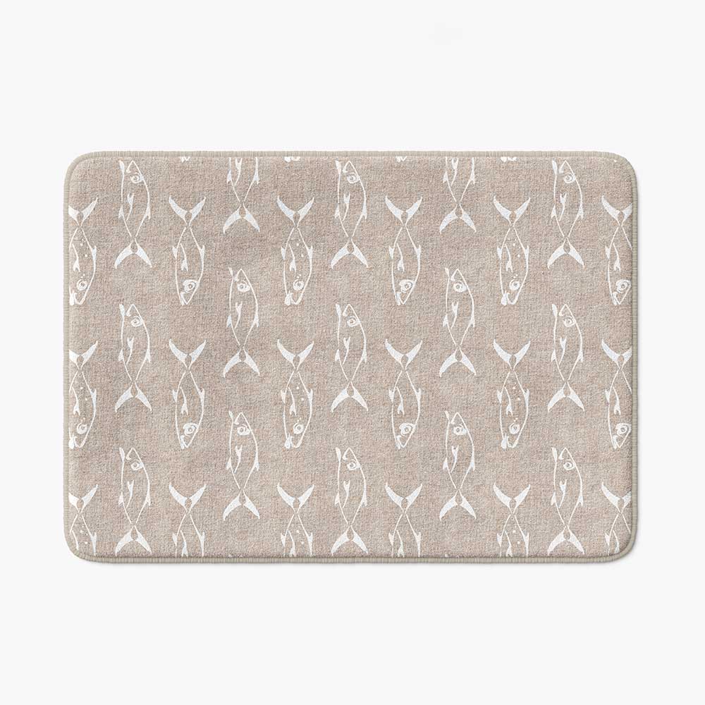 Beige non-slip bath mat featuring white trevally fish design.