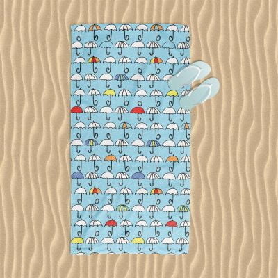 kids beach towel with blue colorful umbrella pattern