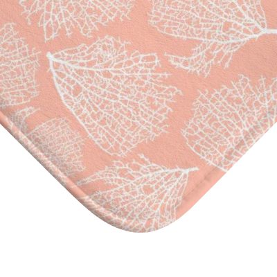 Pink coral patterned microfiber bath mat for coastal bathroom vibe.
