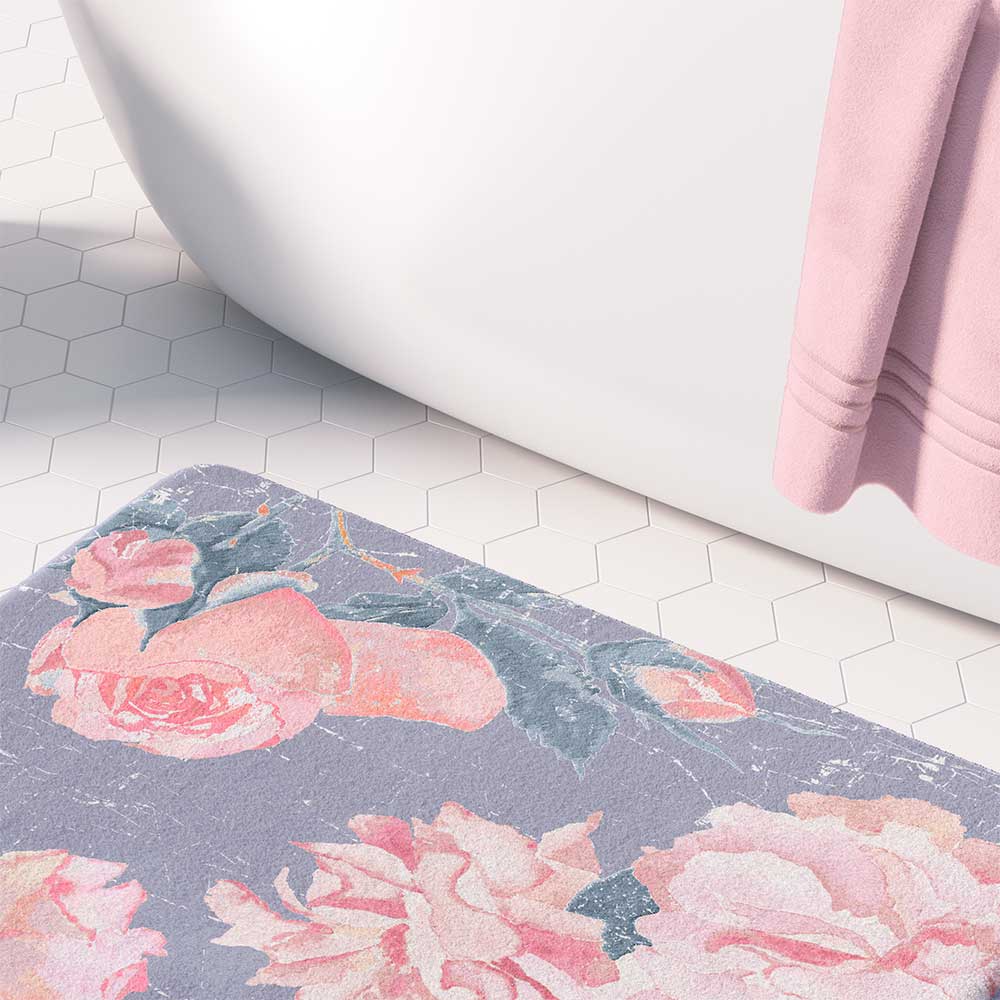 A vintage pink rose watercolor floral bath mat in lavender purple, perfect for adding elegance to any bathroom. Mold and mildew resistant, quick-drying, non-slip plush microfiber, washable.