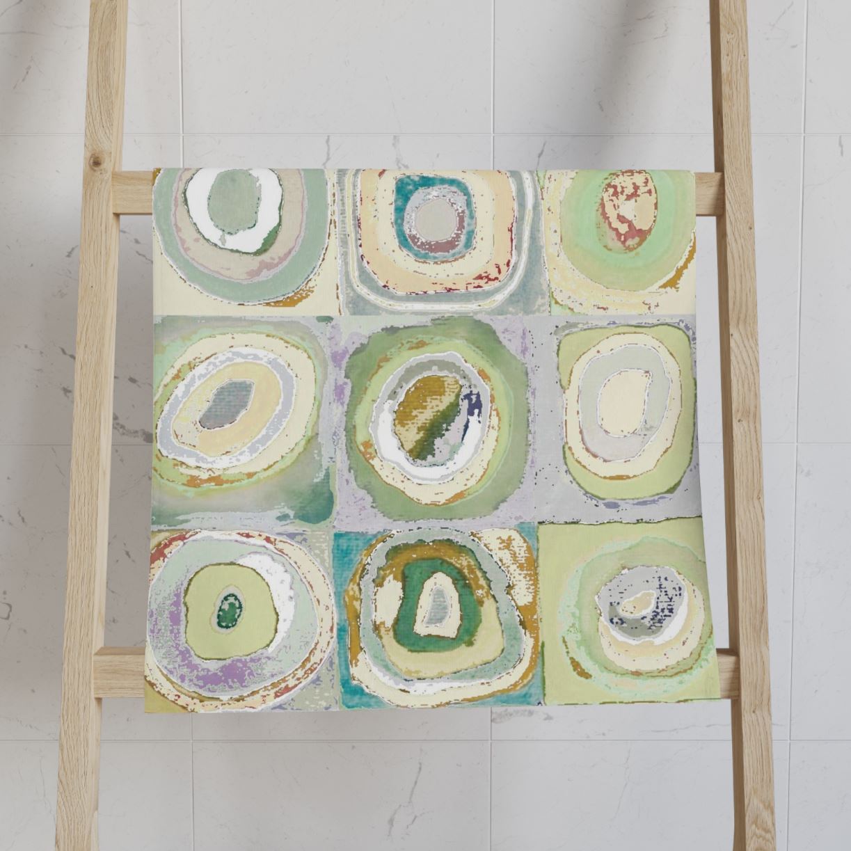 Green, yellow, and gray artistic abstract patterned hand towel.