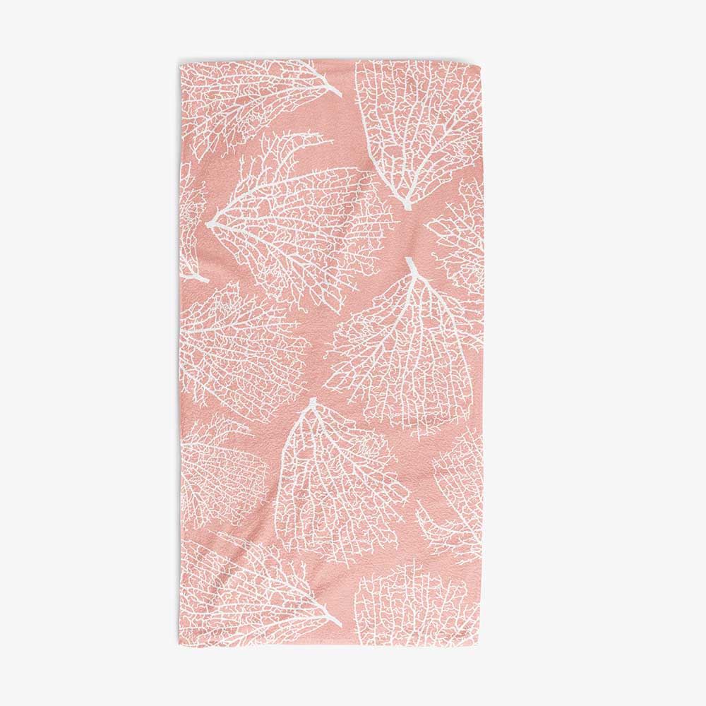 Bath towel with elegant tropical coral pink pattern.