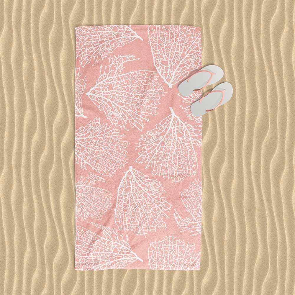 Beach towel with elegant tropical coral pink pattern.