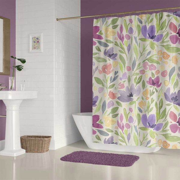 Floral shower curtain hanging in a bathroom setting.