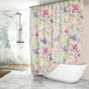 Side view of the floral shower curtain, highlighting its waterproof feature.