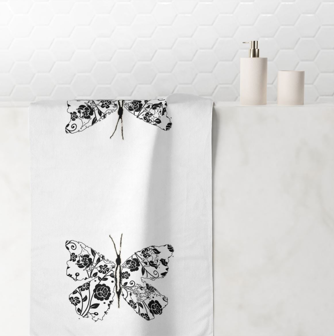 Hand towel with black and white abstract butterfly print, perfect for a modern girls' bathroom.