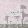 Soft pink watercolor leaves wallpaper in a hallway, creating a serene and elegant atmosphere