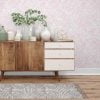 Soft pink watercolor leaves wallpaper in a hallway, creating a serene and elegant atmosphere