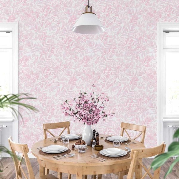 Soft pink watercolor leaves wallpaper in a dining room, creating a stylish and elegant dining space
