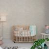 Contemporary beige and white elephant wallpaper in a baby nursery