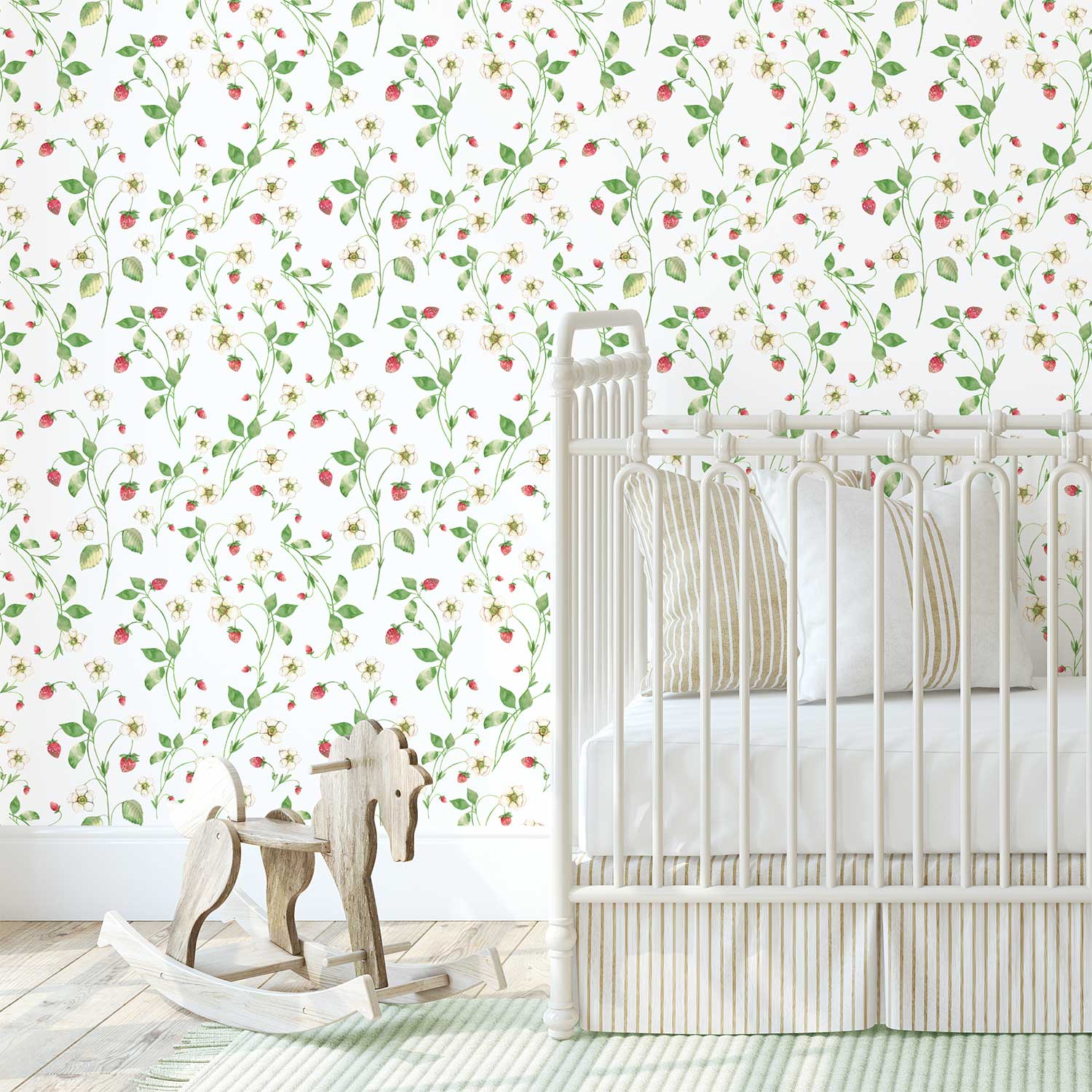 Charming strawberry field floral wallpaper adds a fresh, nature-inspired touch to a girl's baby nursery.