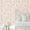 Pink strawberry floral wallpaper in a baby girl's nursery