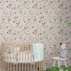 Pink strawberry floral wallpaper in a baby girl's nursery