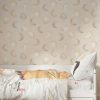 Neutral moon wallpaper in bedroom with soft beige bedding