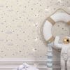 Soft Skies micro stars wallpaper behind bed in boys bedroom