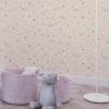 Micro stars wallpaper in kids’ playroom with rugs and toys