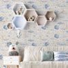 Neutral celestial wallpaper in kids playroom with cozy floor rugs