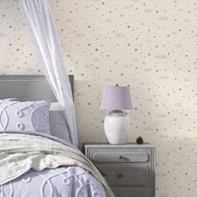 Soft Skies micro star wallpaper behind toddler bed with pastel accents