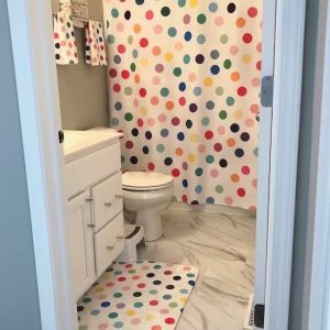 Kids bathroom with fun shower curtain in bright playful design